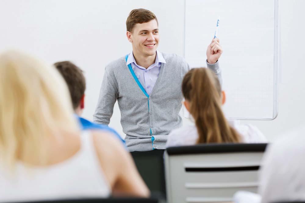 Man giving a presentation to other adults