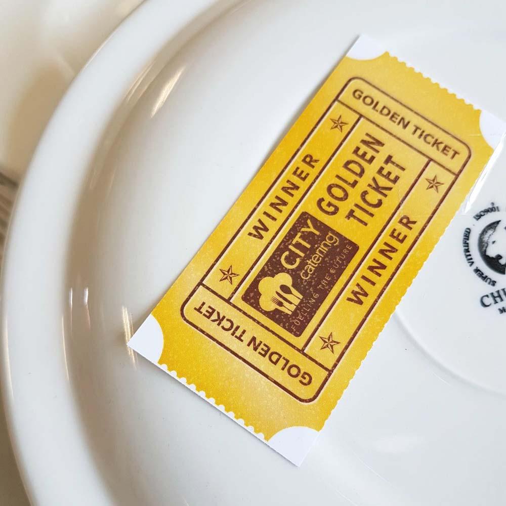 Golden ticket on white plate